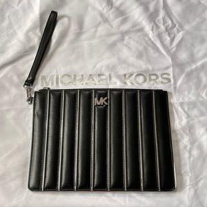 New without tags Michael Kora black clutch
